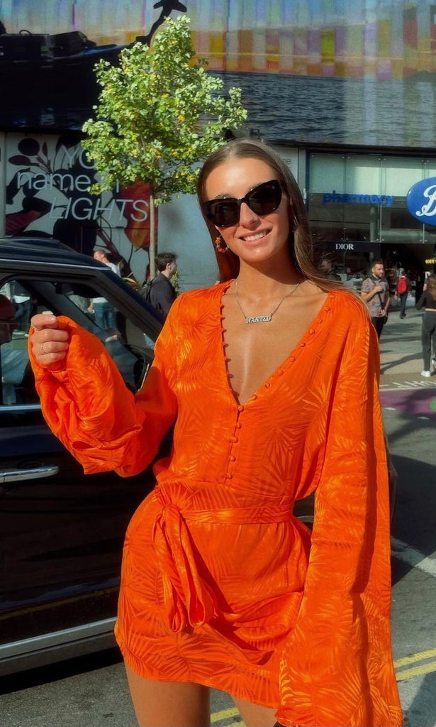 Burnt Orange Harlequin Mini Dress for holiday dress hire