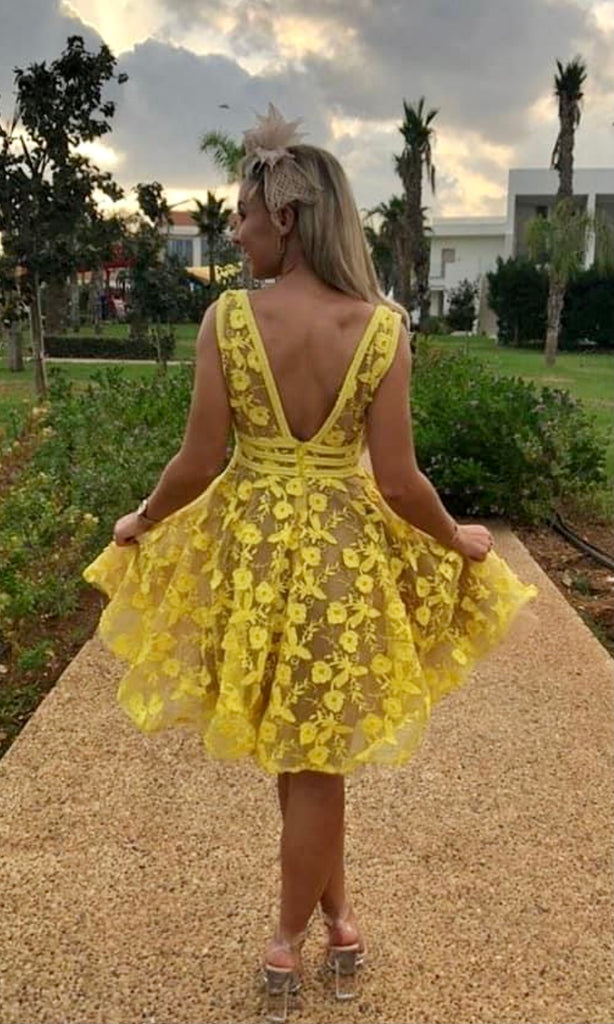 Rear of Lola Mini Dress in Lemon for wedding guest dress hire